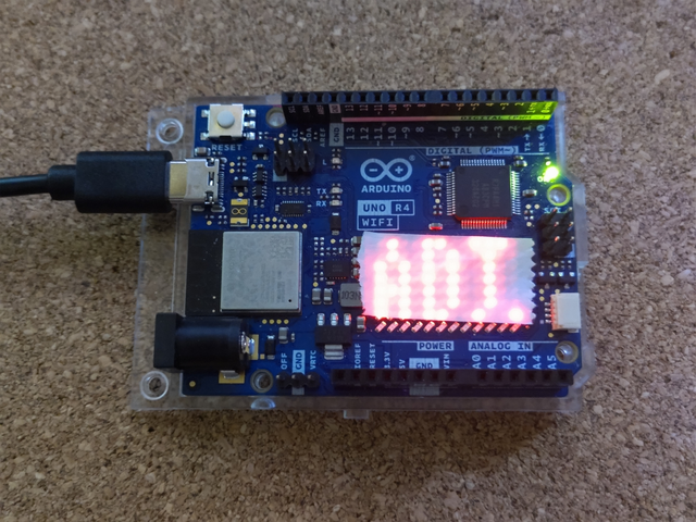 時刻取得中は ADJ.表示